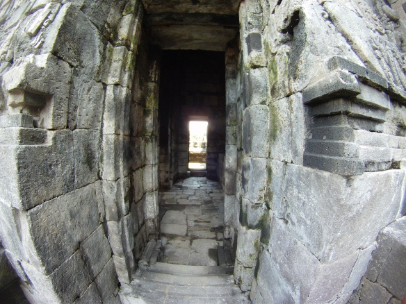Old rock entrance and long dark hallways